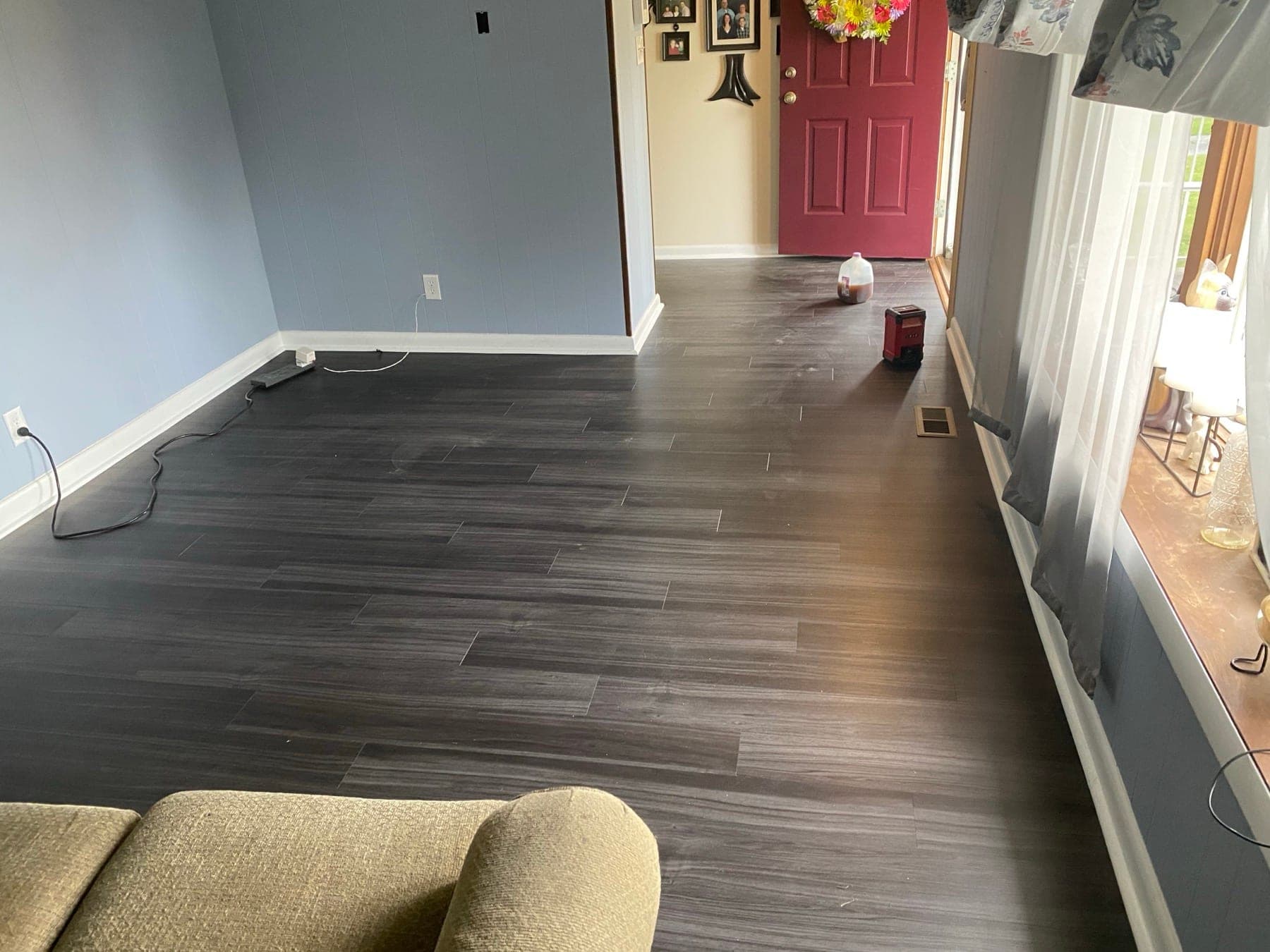Dark laminate flooring installed in living room