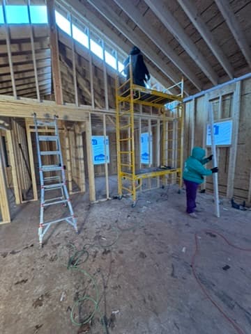 Interior framing crew working on scaffolding