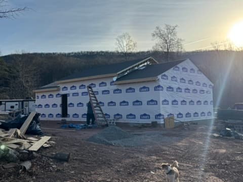 New construction house wrap at sunset