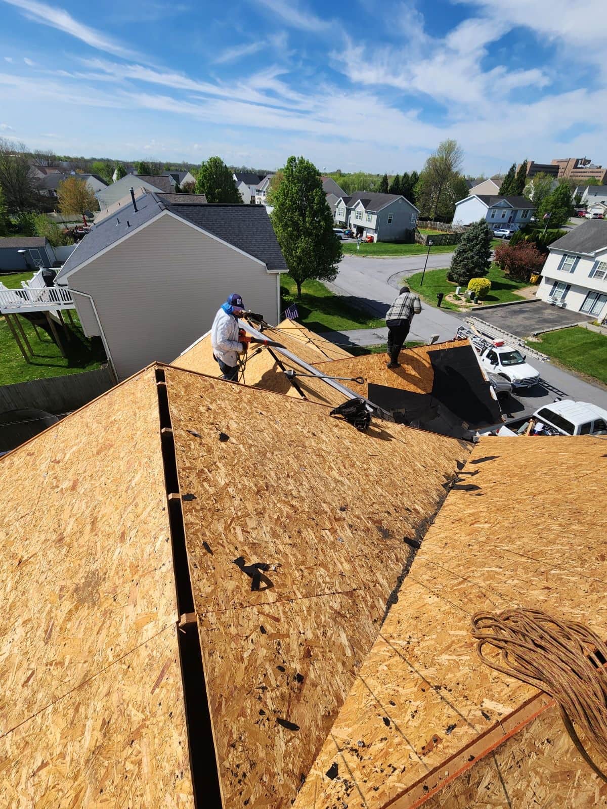 Roofing crew working on full tear-off and re-roof