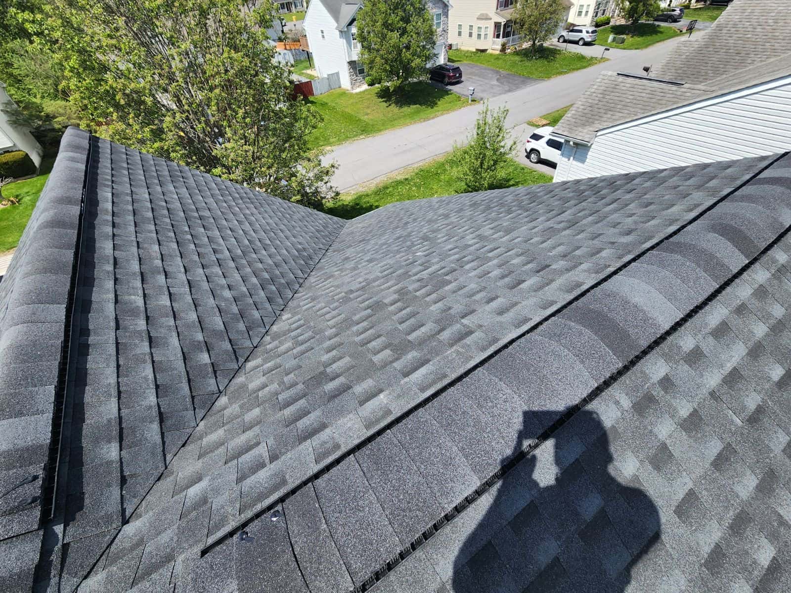 New charcoal shingle roof with clean valley lines