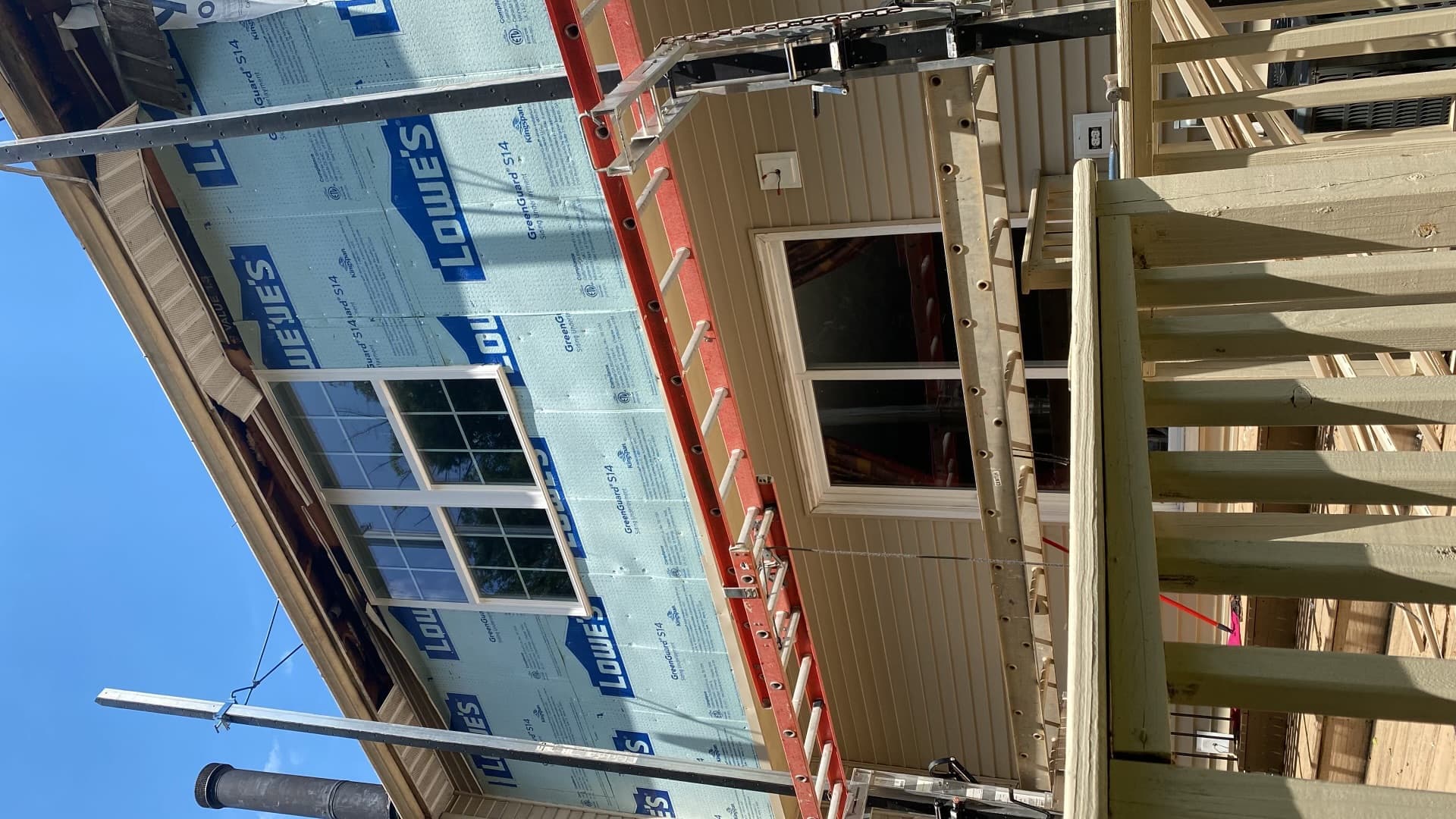 Siding and window replacement in progress